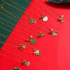 delicate gold christmas necklace with festive charms display