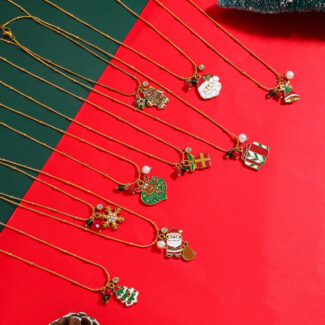 delicate gold christmas necklace with festive charms display